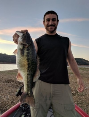 Angels Camp fishing with a beautiful sunrise in the background. Huge spotted bass.